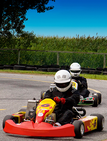 AusSport Scoreboards two motor karts racing on track